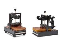 A Pair of Regency Style Ebony and Rosewood Book Presses