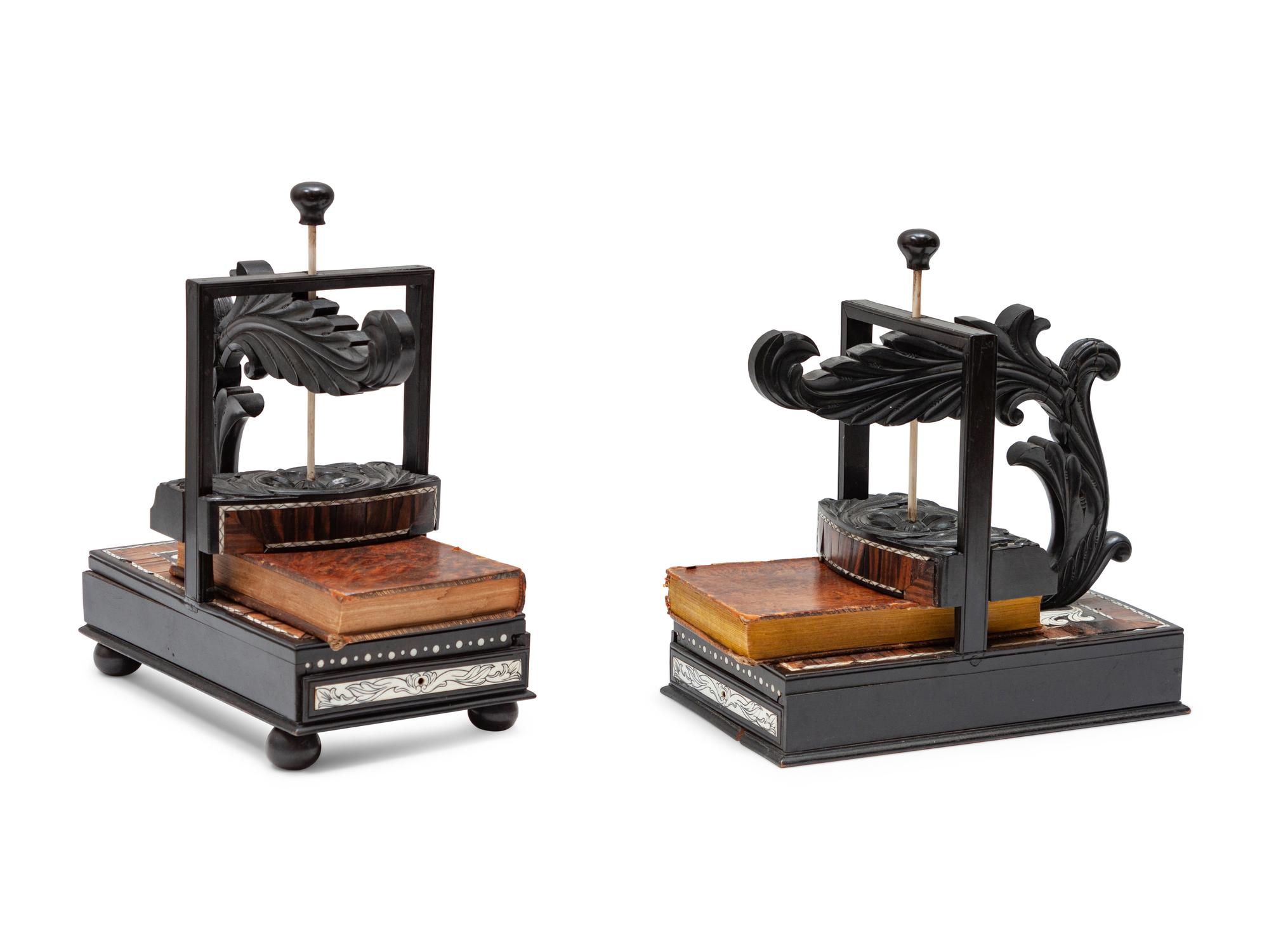 A Pair of Regency Style Ebony and Rosewood Book Presses