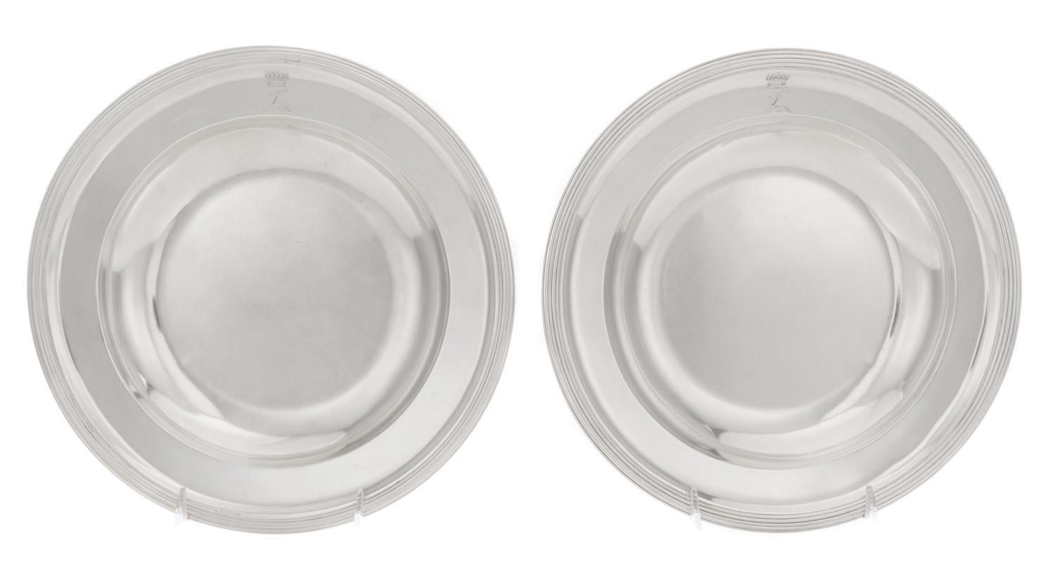 A Pair of Austrian Silver Plates, 1798-1799, circular with reeded rims, the borders engraved with later crest of an arm embowed graspin