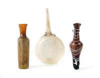 A Group of Three Islamic Glass Vessels, Height of tallest 5 1/2 inches.