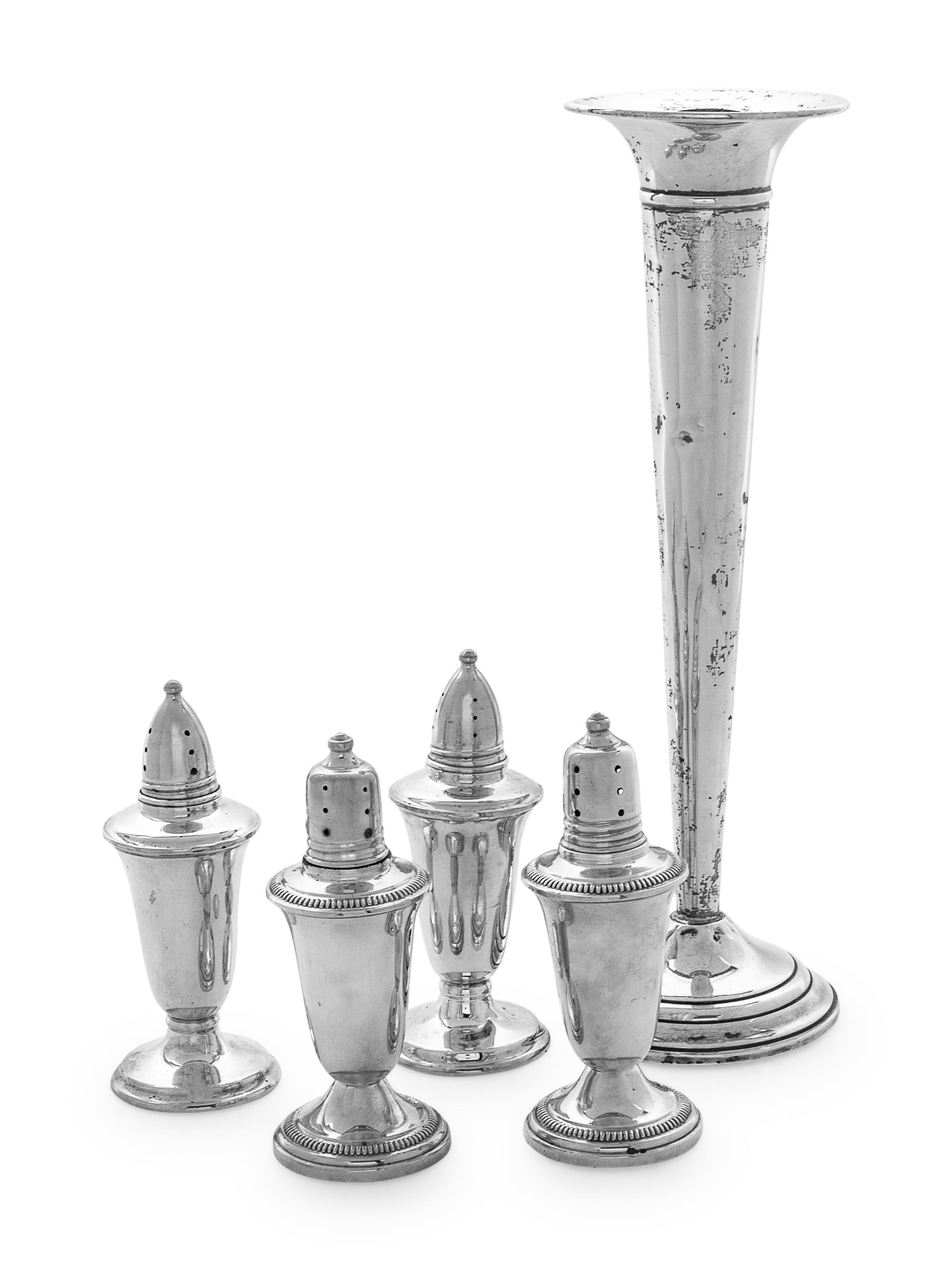 comprising one weighted trumpet vase and two sets of weighted casters.