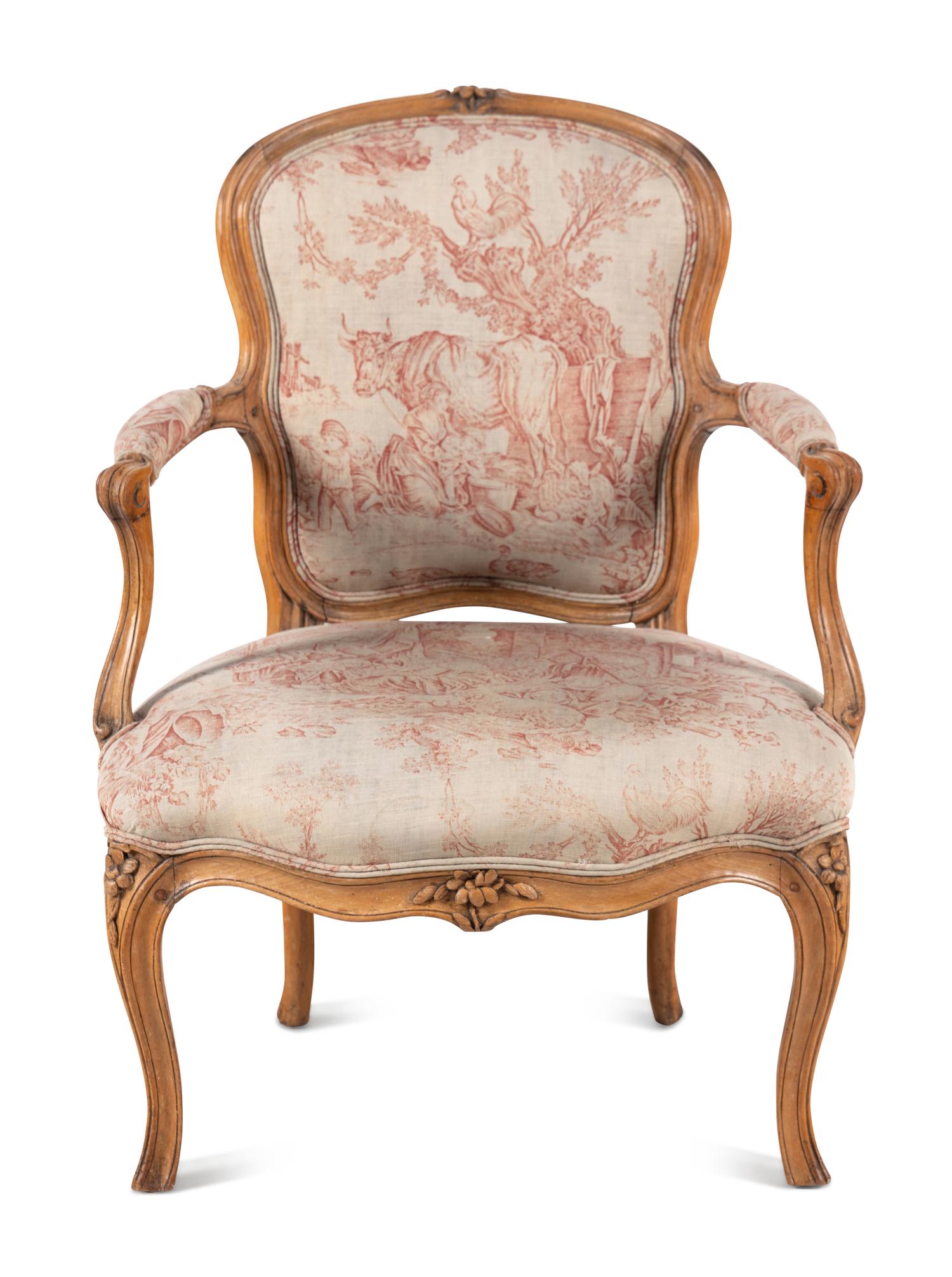 A Louis XV Carved Fruitwood Fauteuil