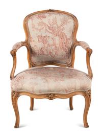 A Louis XV Carved Fruitwood Fauteuil