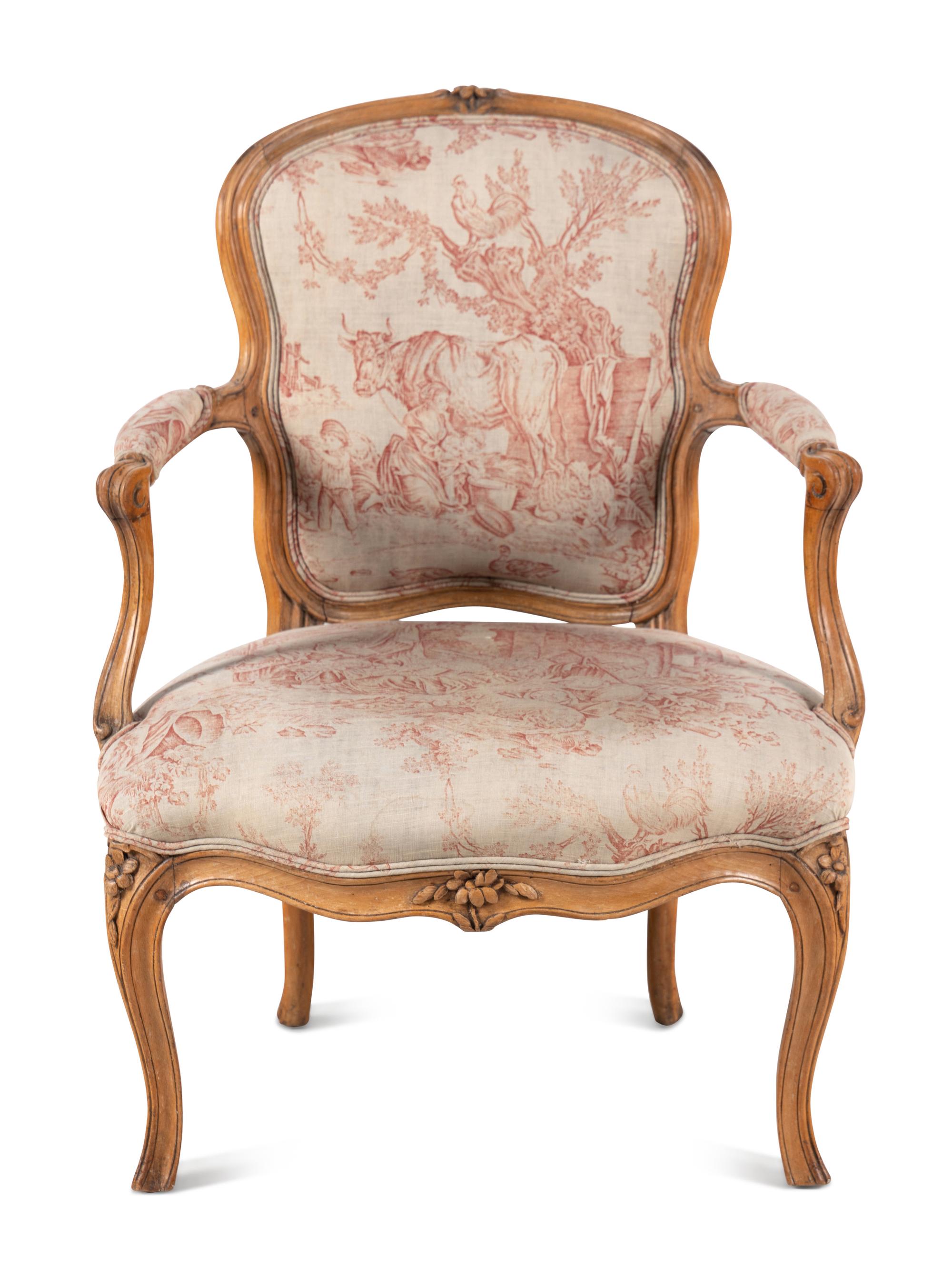 A Louis XV Carved Fruitwood Fauteuil