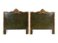 A Pair of Neoclassical Painted and Parcel Gilt Headboards