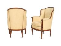 A Pair of Louis XVI Style Carved Walnut Bergères