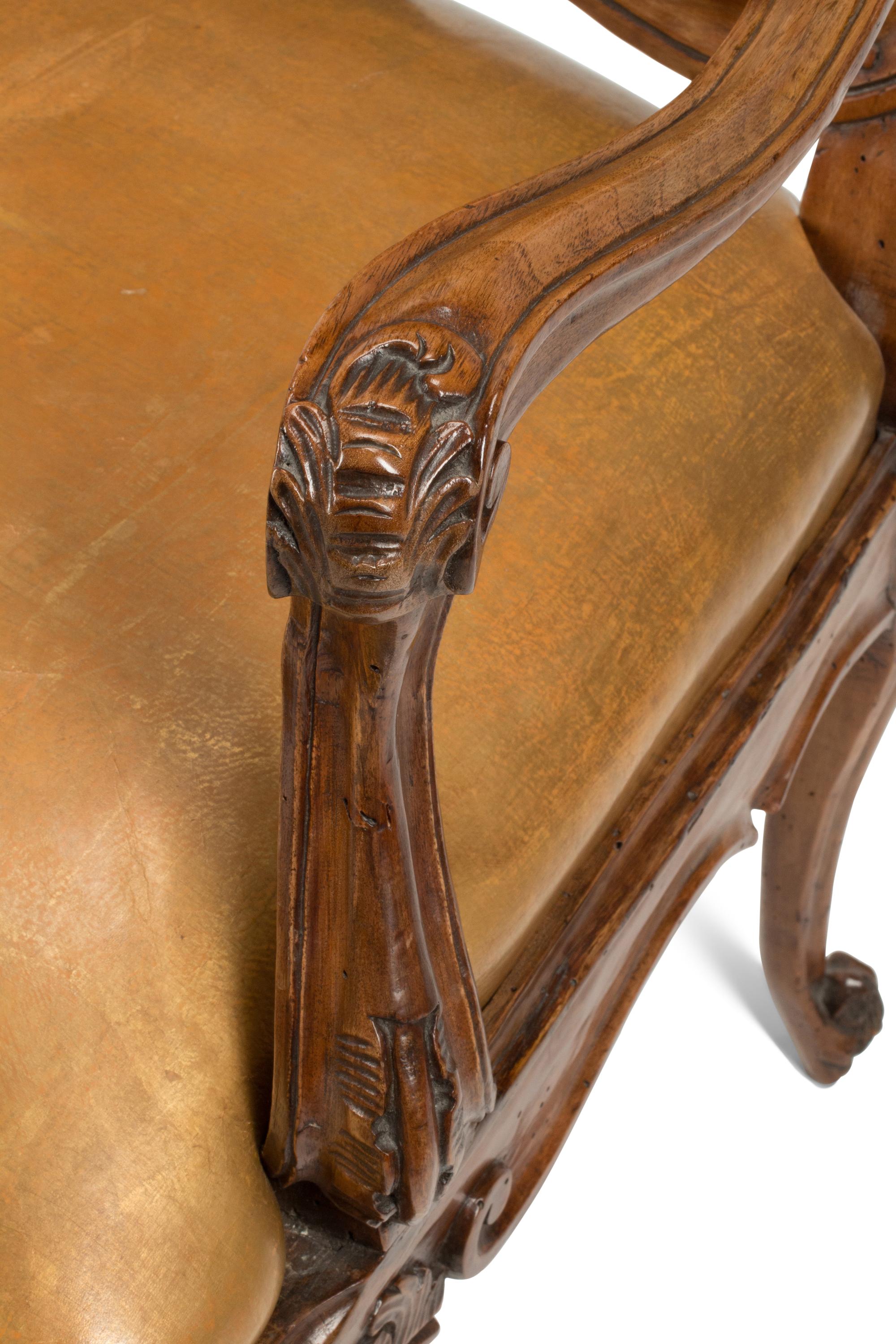 A Pair of French Provincial Carved Walnut Armchairs