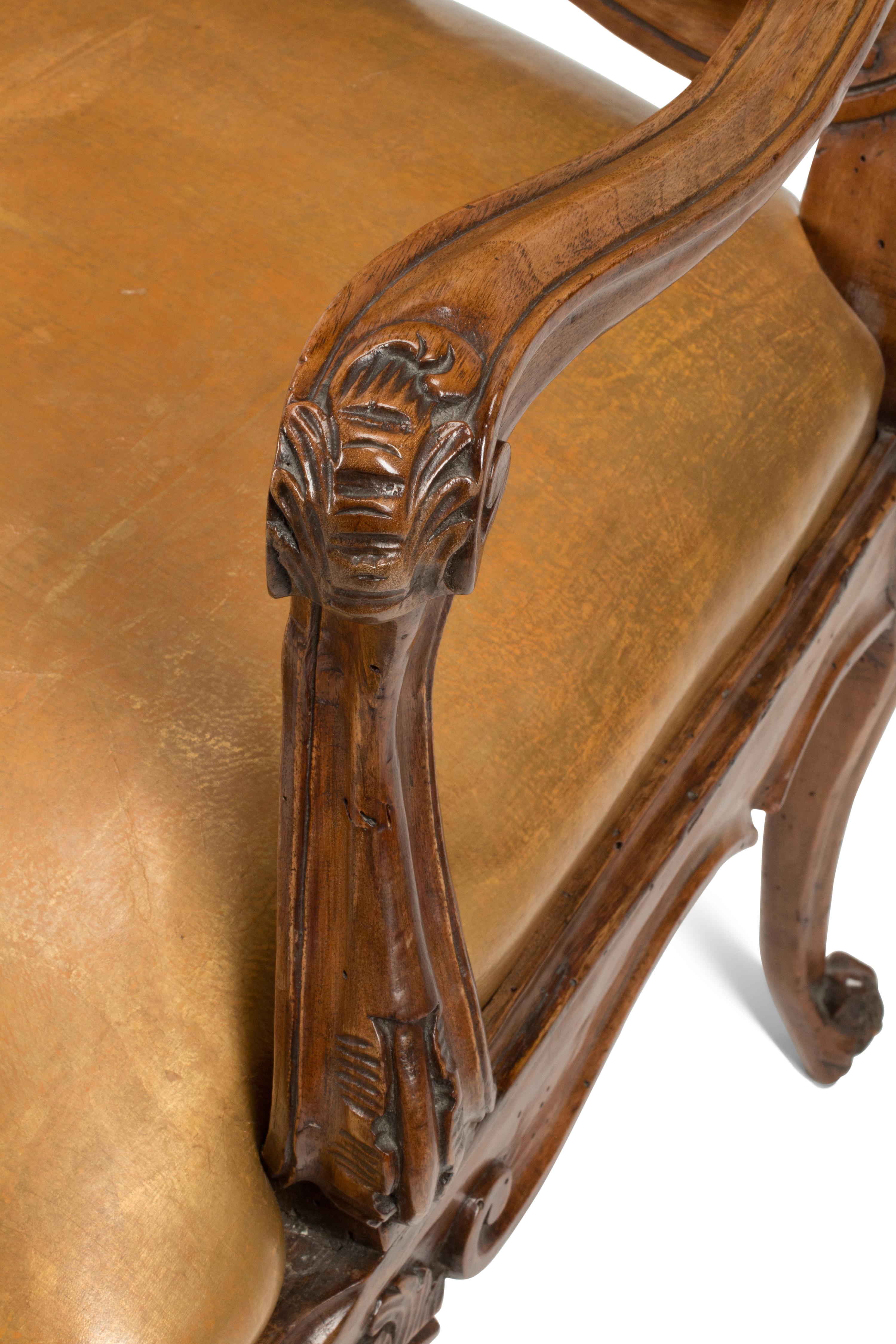 A Pair of French Provincial Carved Walnut Armchairs