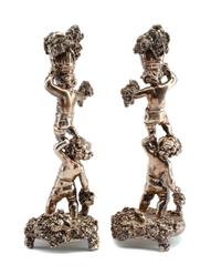 A Pair of Silver Figural Candlesticks, Circa 2000, each in the form of two Bacchanalian putti supporting a bushel of grape bunches, wei