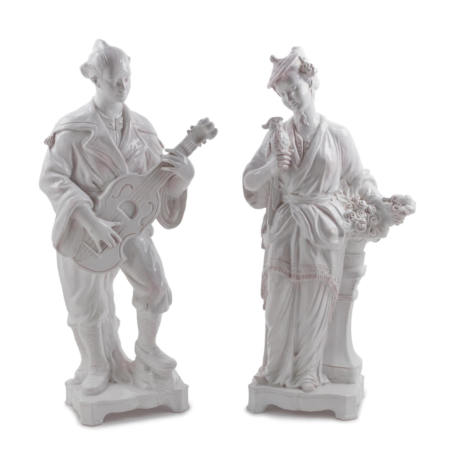A Pair of Large Mottahedeh White Glazed Terra Cotta Chinoiserie Figures