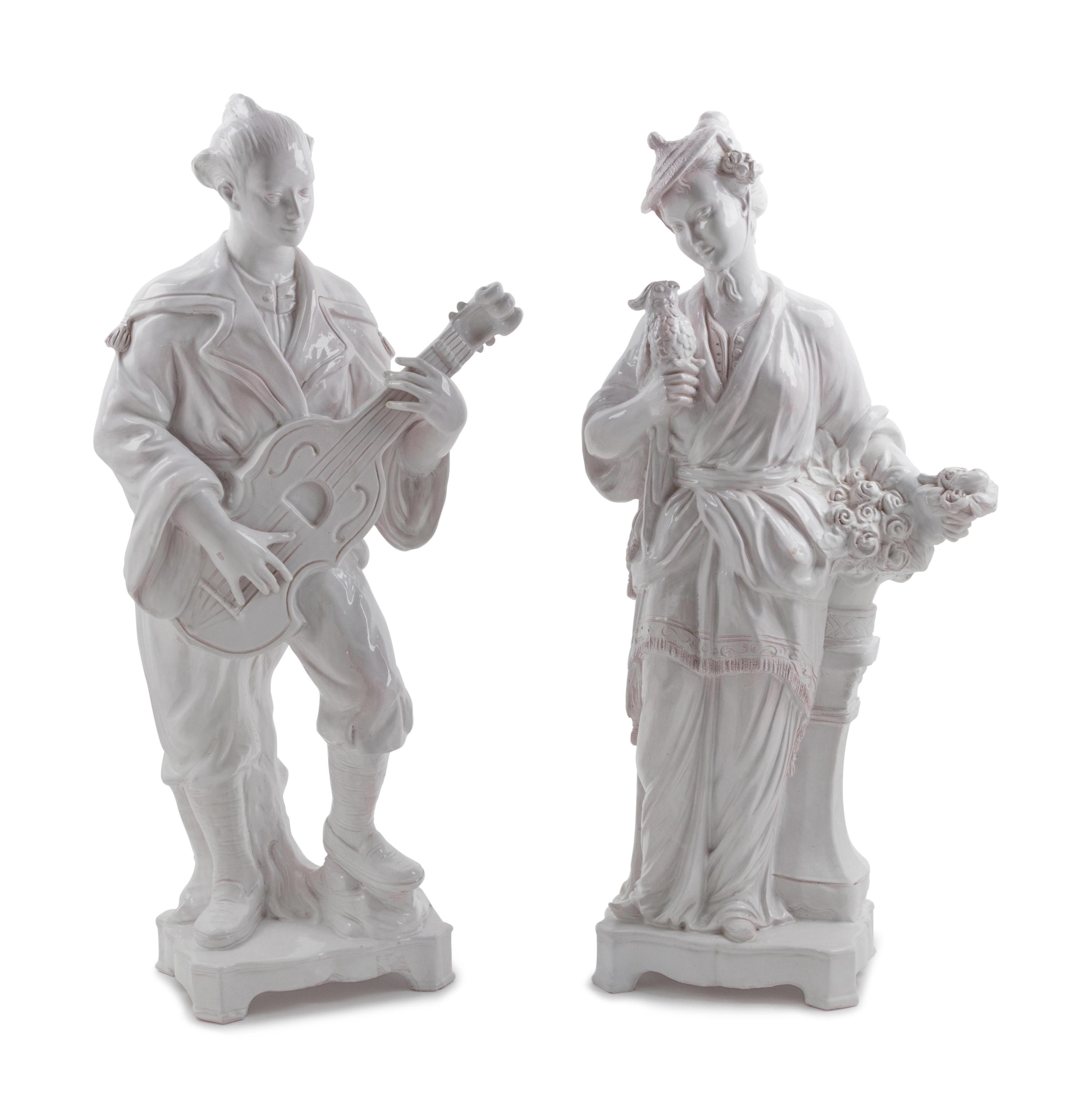 A Pair of Large Mottahedeh White Glazed Terra Cotta Chinoiserie Figures