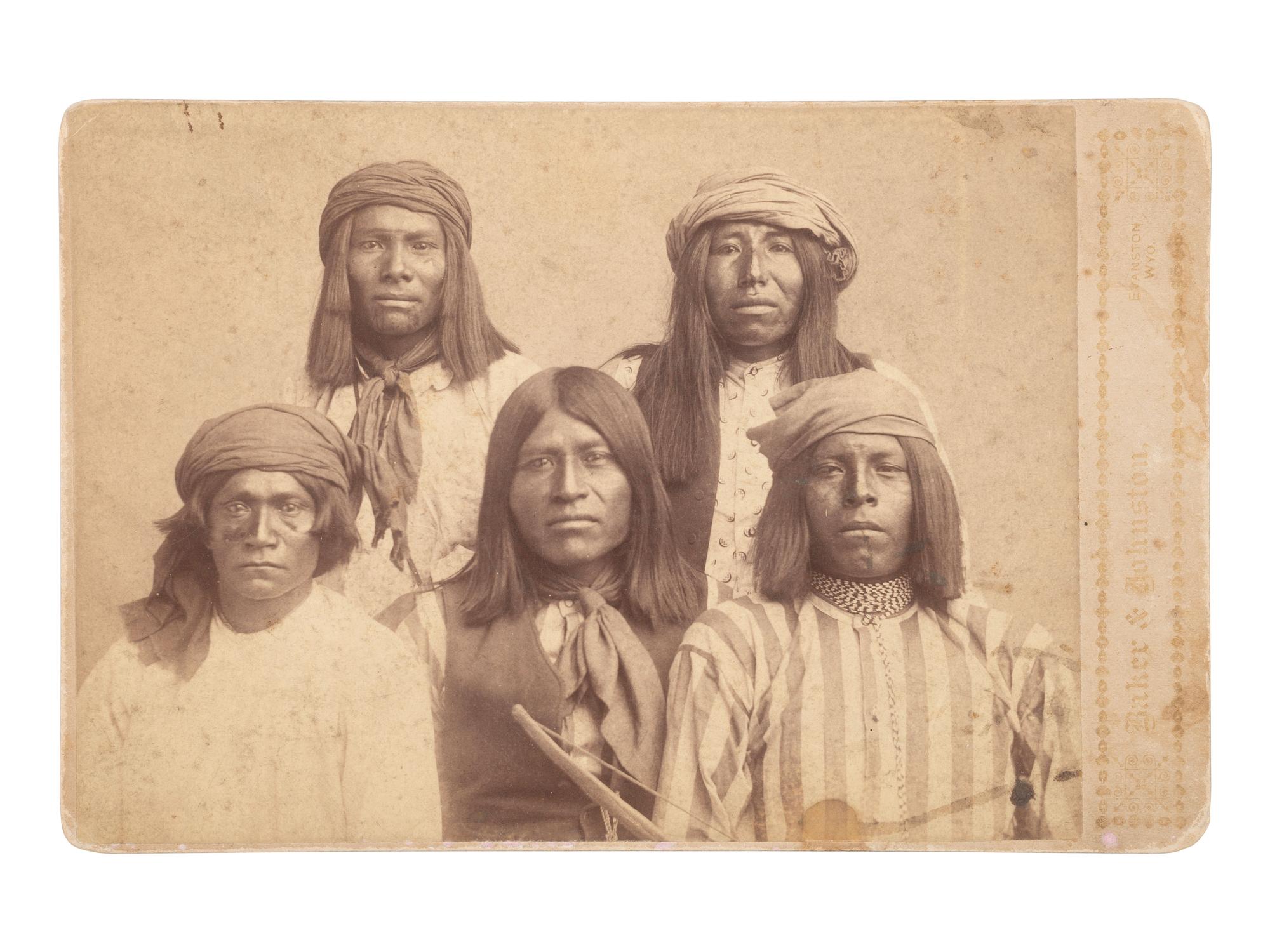 [NATIVE AMERICANS]. BAKER & JOHNSTON, photographers. Cabinet card of Apache prisoners.