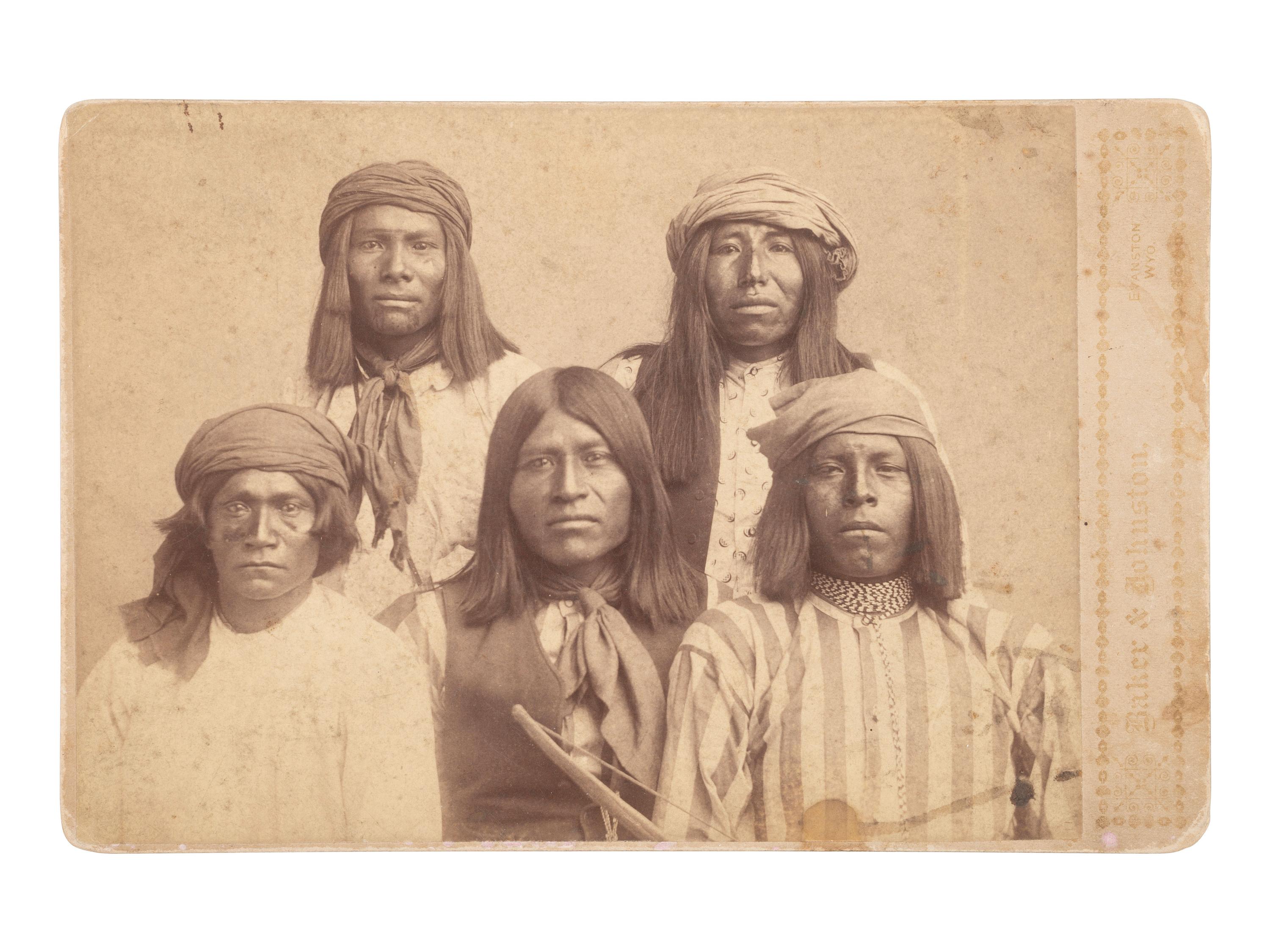 [NATIVE AMERICANS]. BAKER & JOHNSTON, photographers. Cabinet card of Apache prisoners.