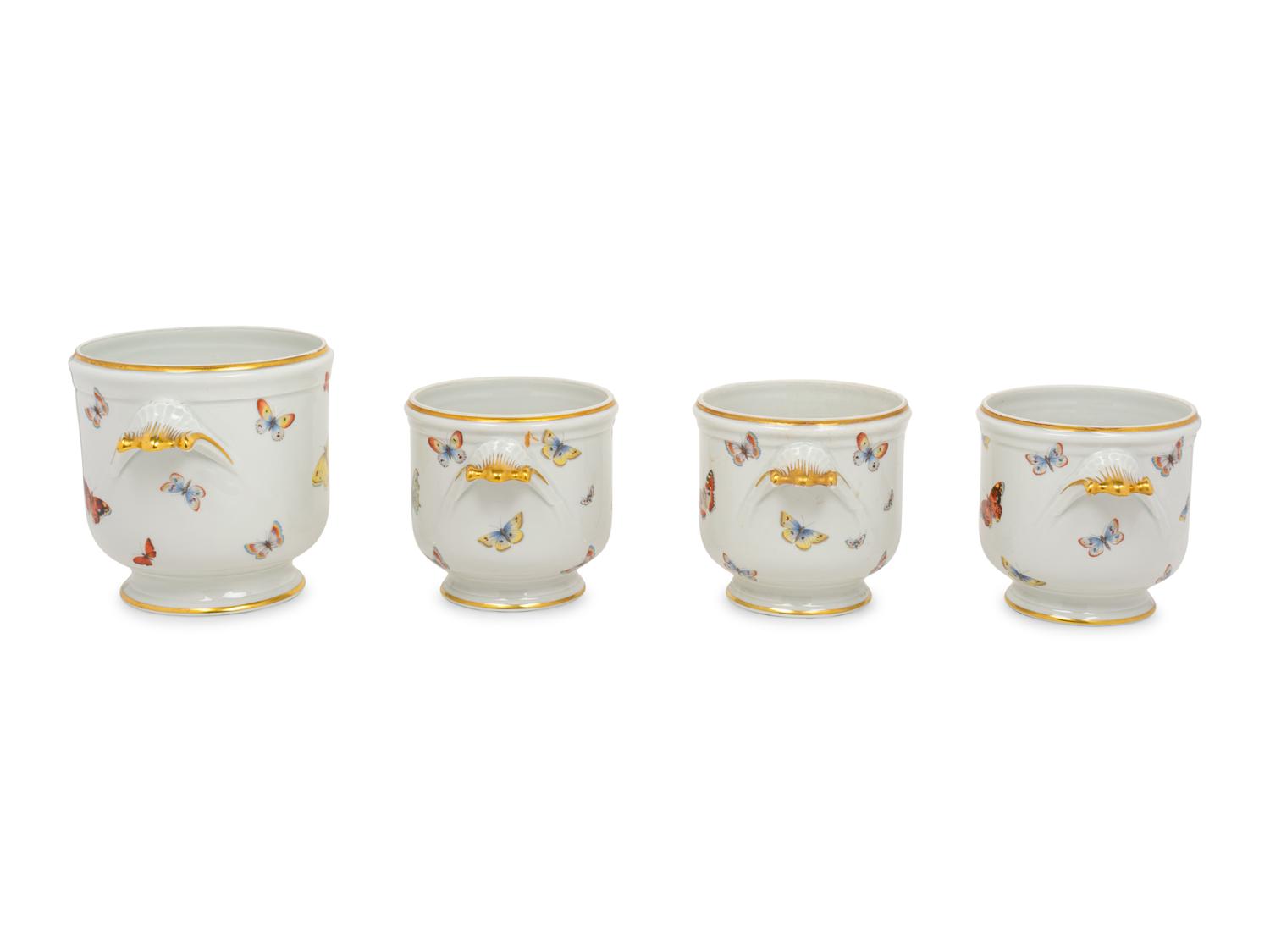 A Set of Four Limoges Porcelain Cache Pots