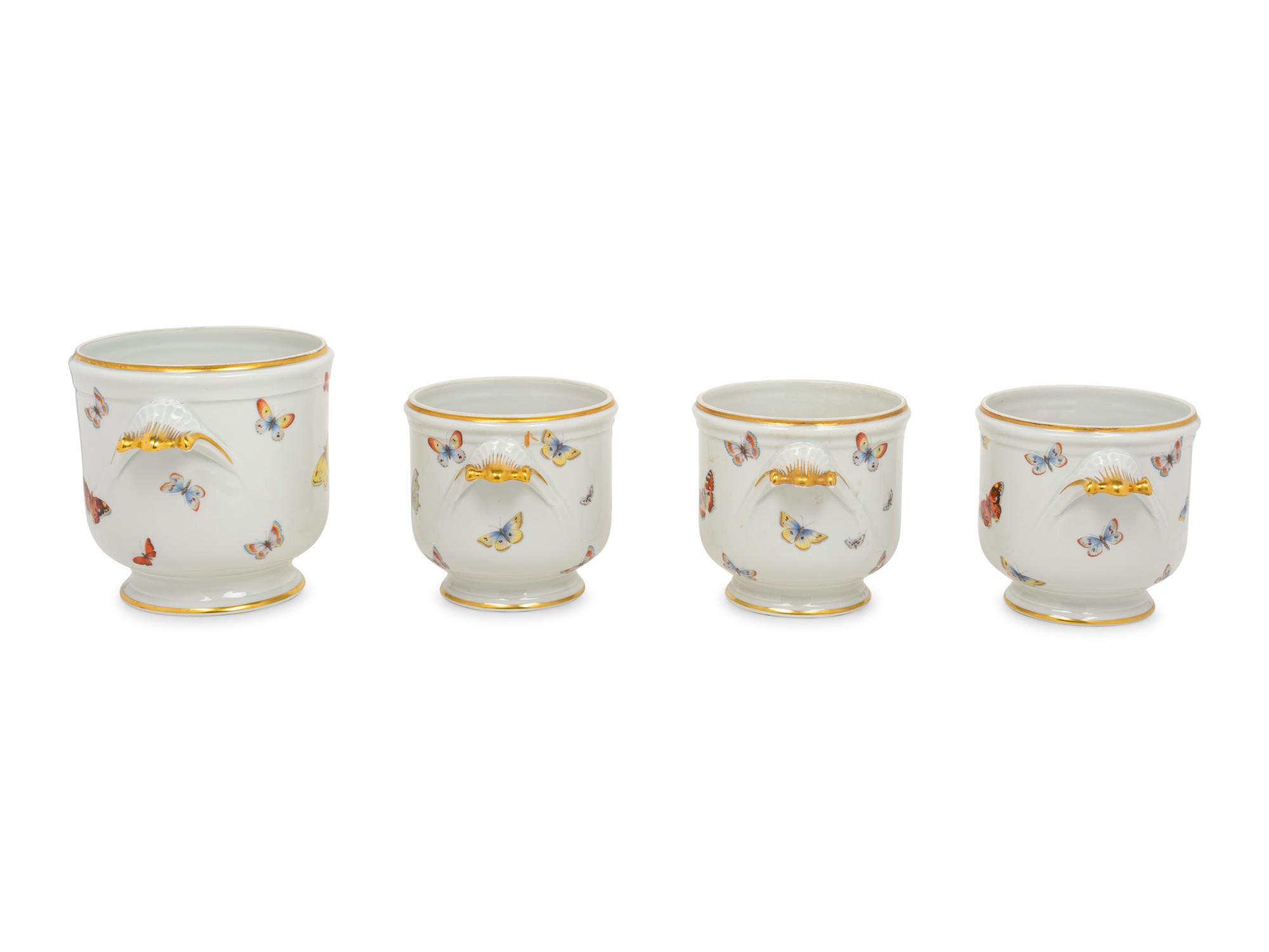 A Set of Four Limoges Porcelain Cache Pots