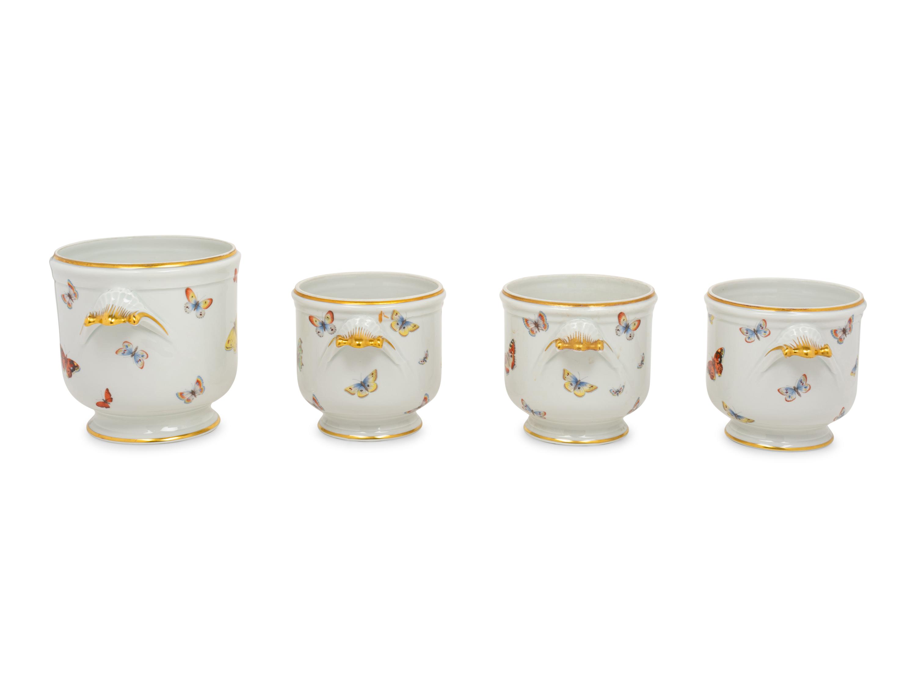 A Set of Four Limoges Porcelain Cache Pots