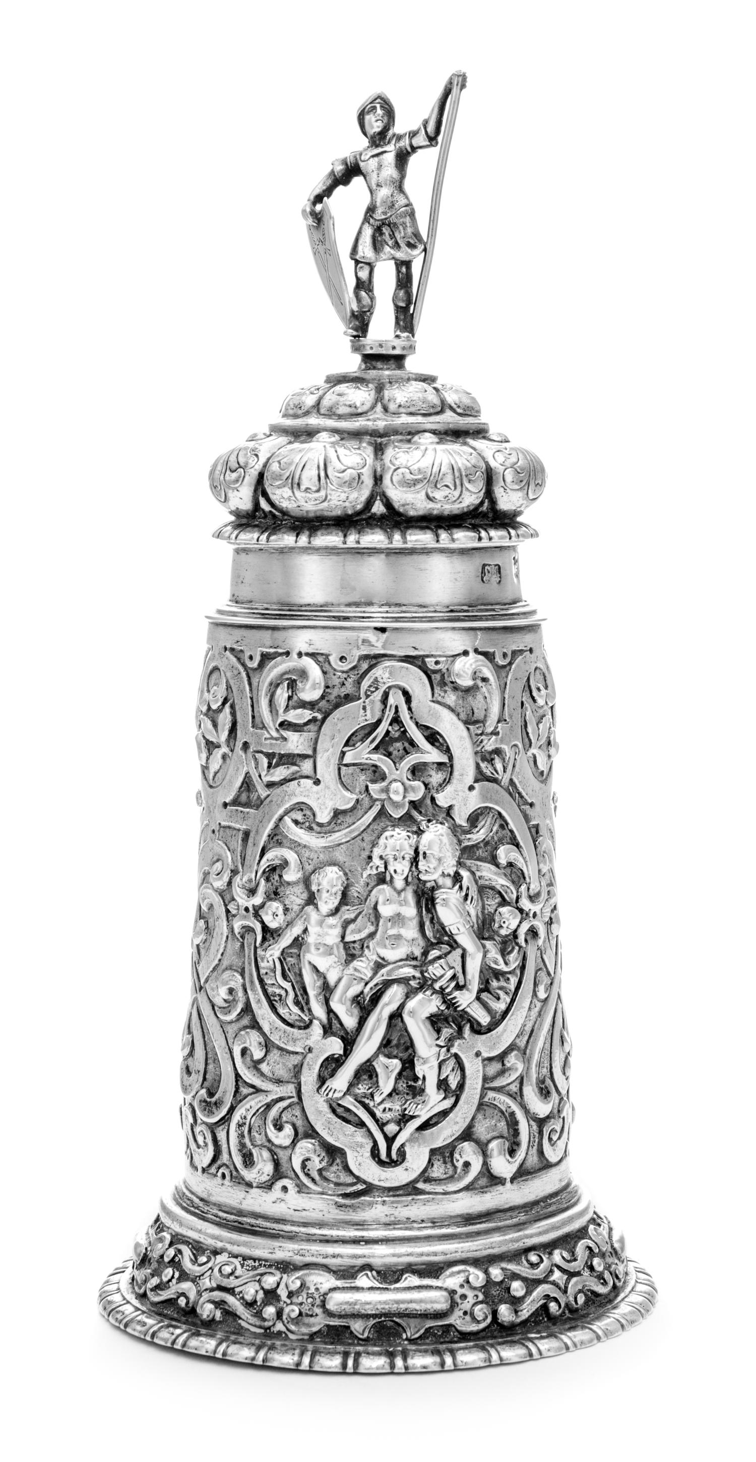 An Estonian Silver Tankard, Maker's Mark ET, Tallinn, Late 19th Century, having a domed cover surmounted by a figural finial, the body