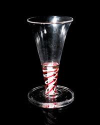 A Red Color Twist Firing Glass
