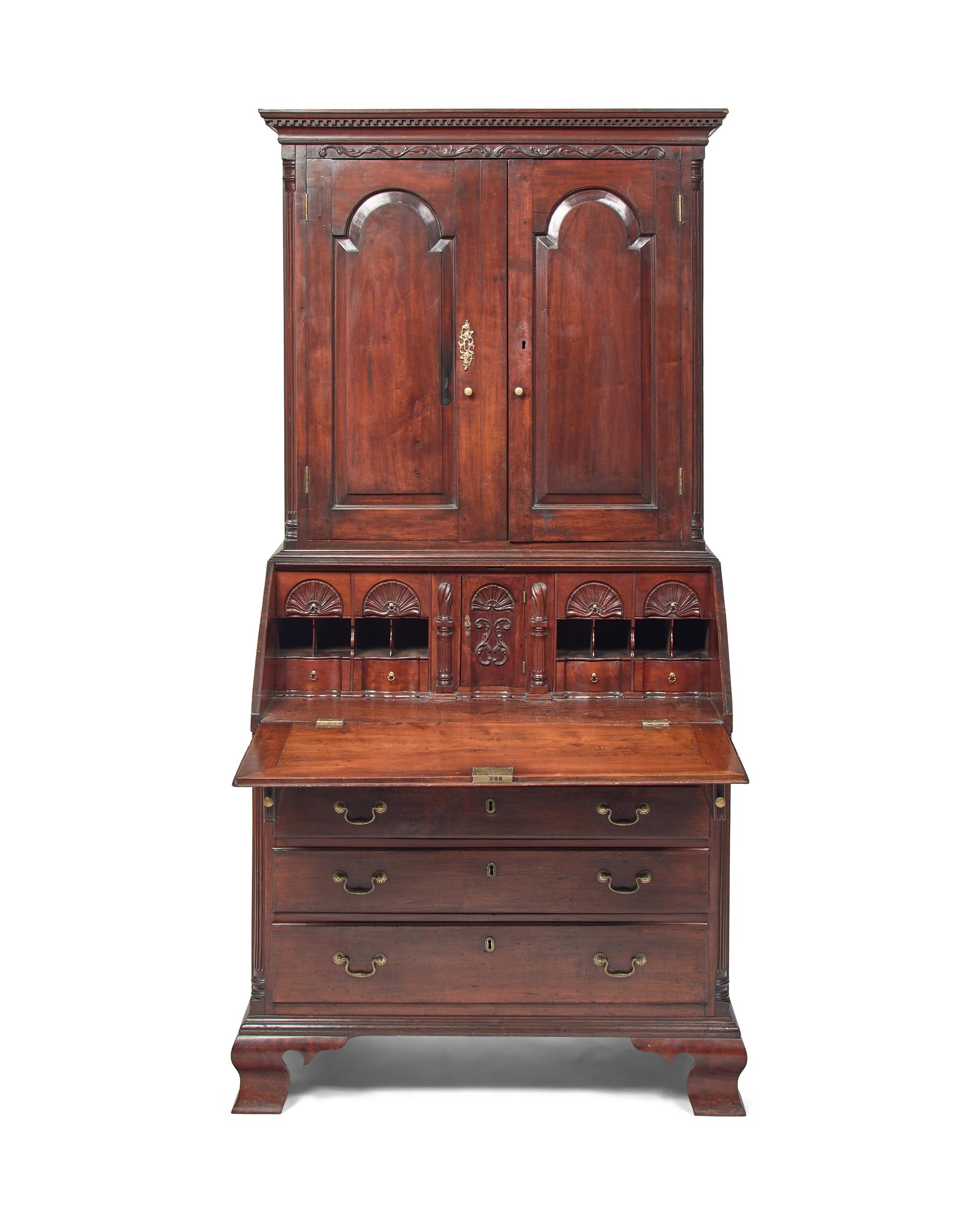 A Chippendale Carved Cherrywood Desk and Bookcase