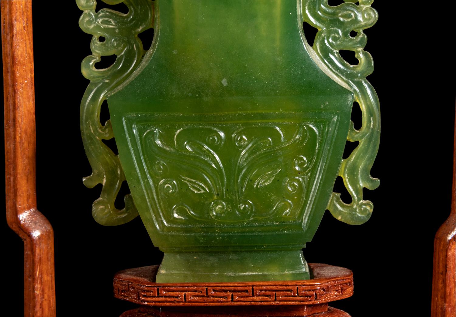 A Chinese Carved Serpentine Hanging Covered Vase