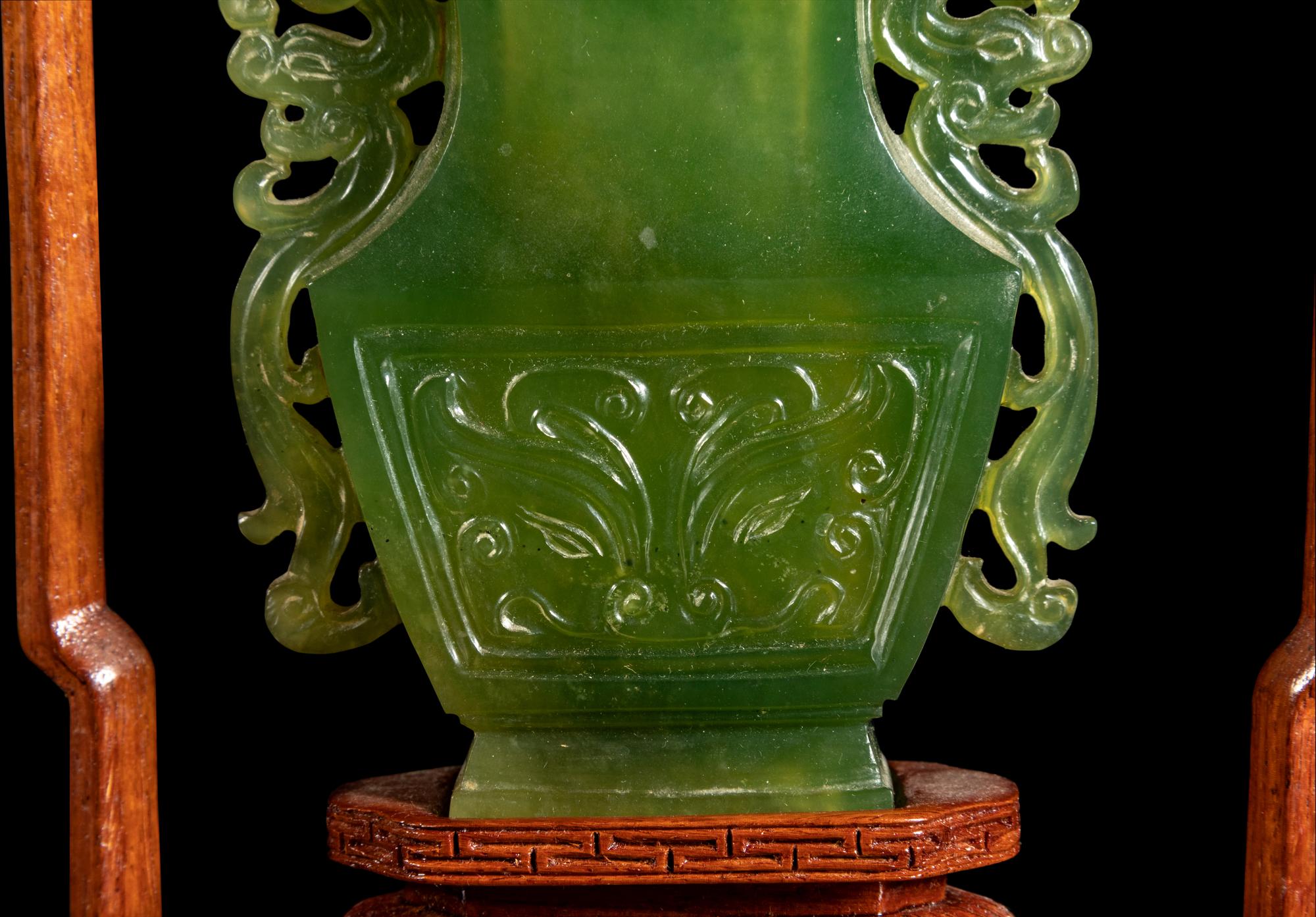A Chinese Carved Serpentine Hanging Covered Vase