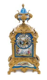 A Louis XVI Style Gilt Metal and Sèvres Style Porcelain Inset Mantel Clock