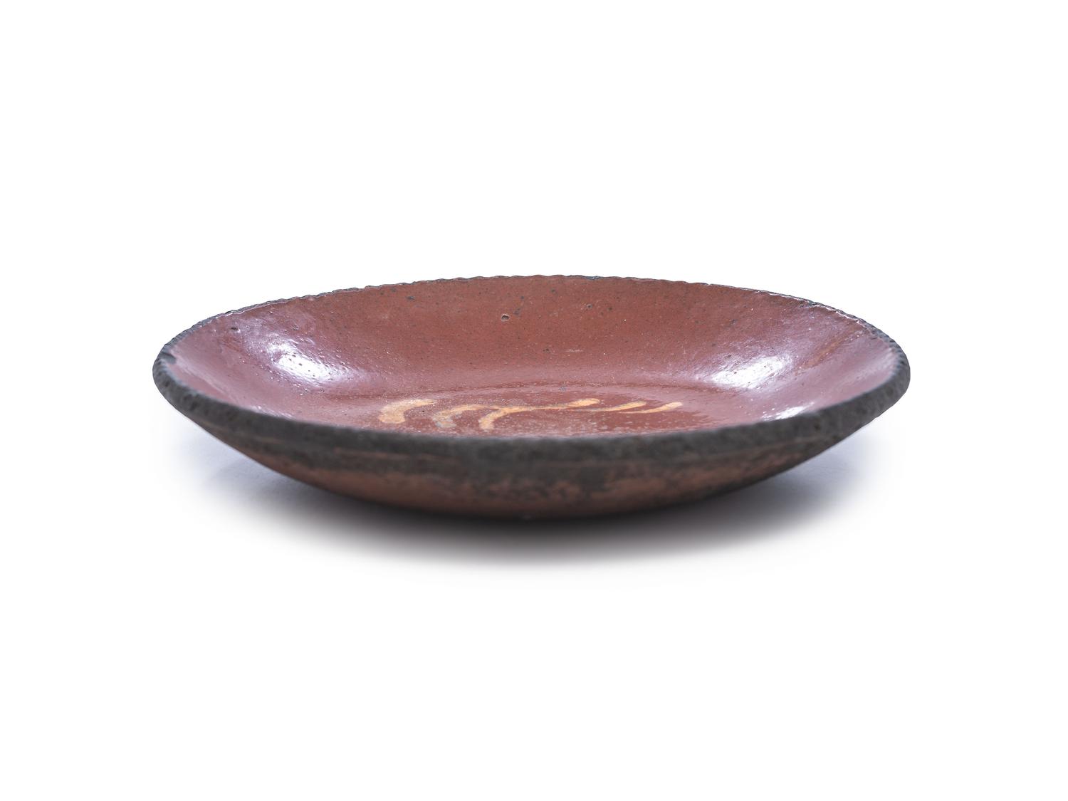 A Redware Slip Glazed Plate