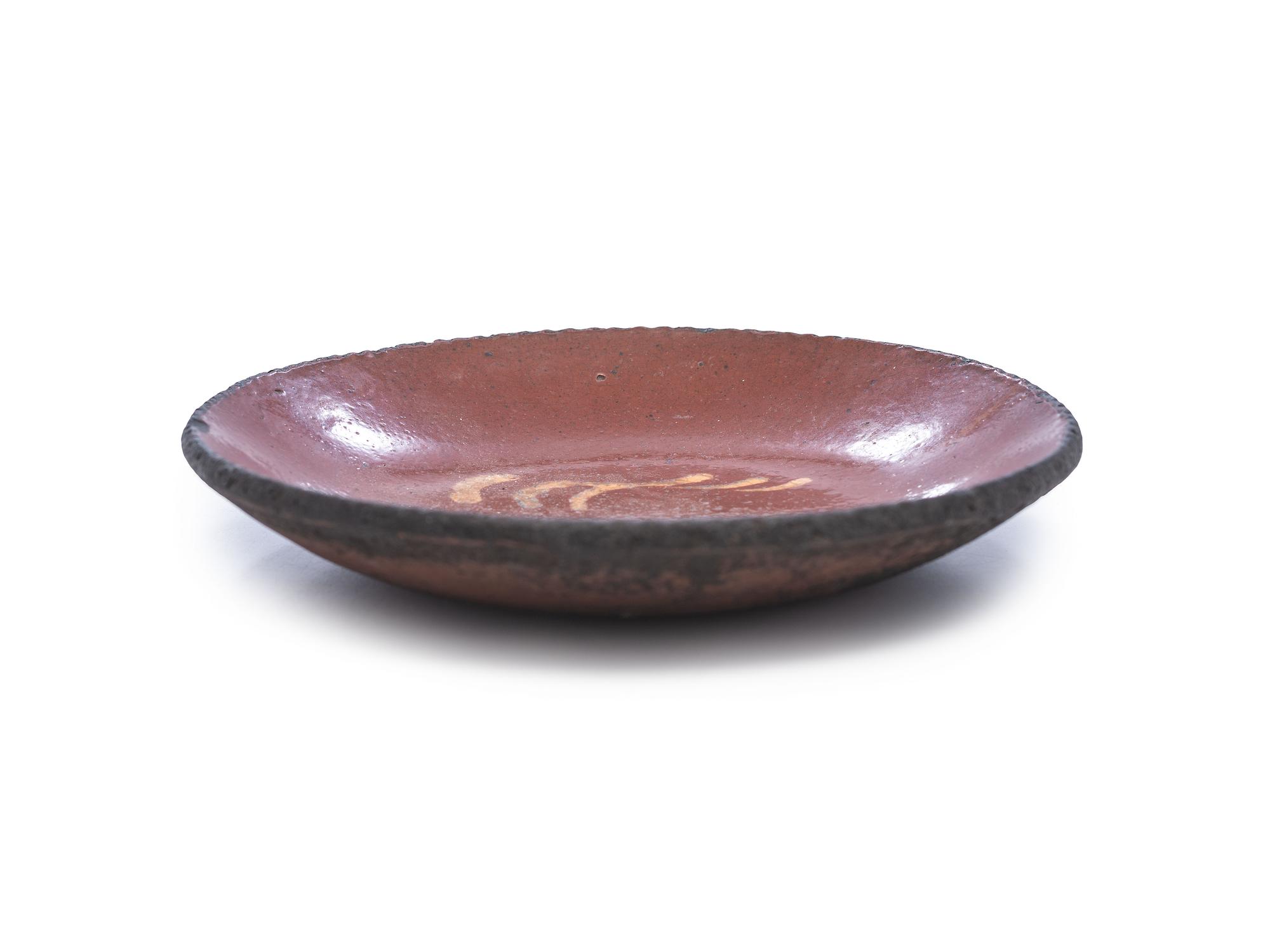 A Redware Slip Glazed Plate