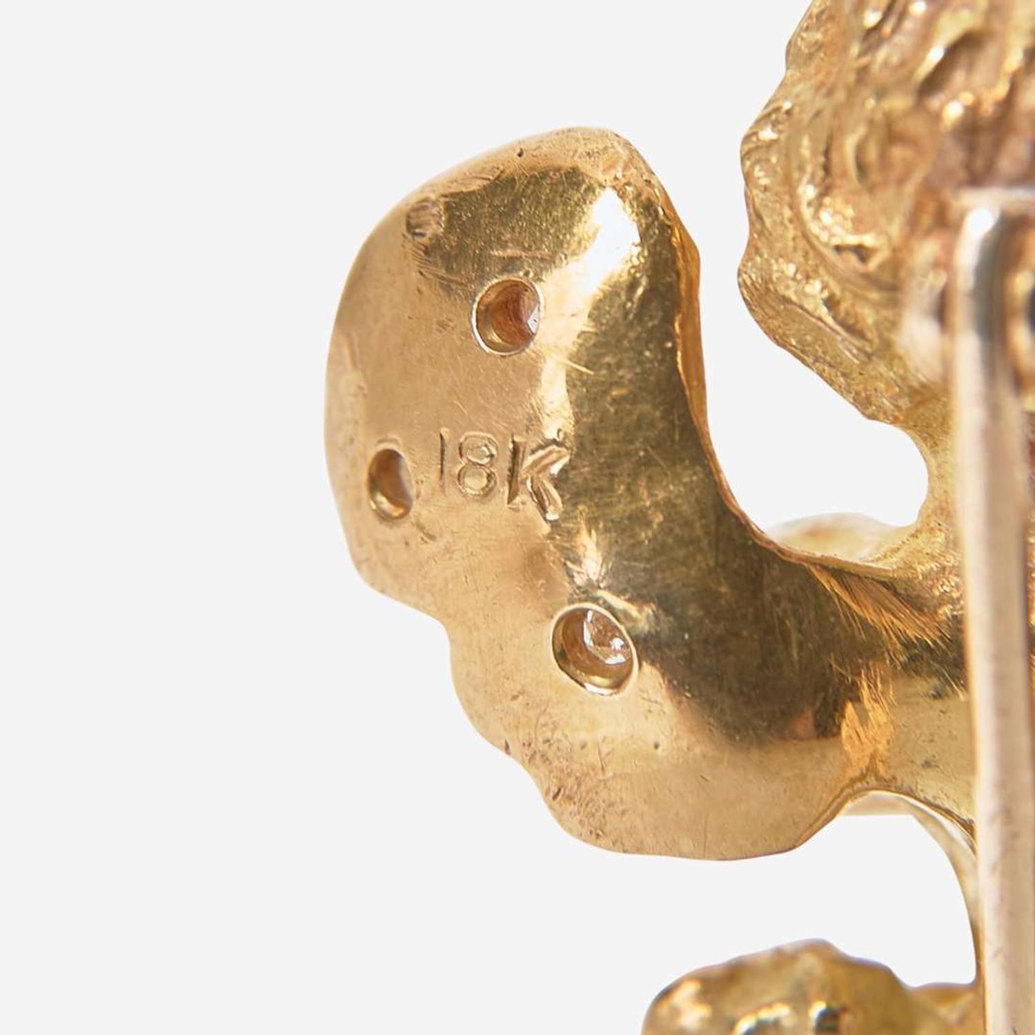 A Collection of Two Yellow Gold and Gemstone Pins