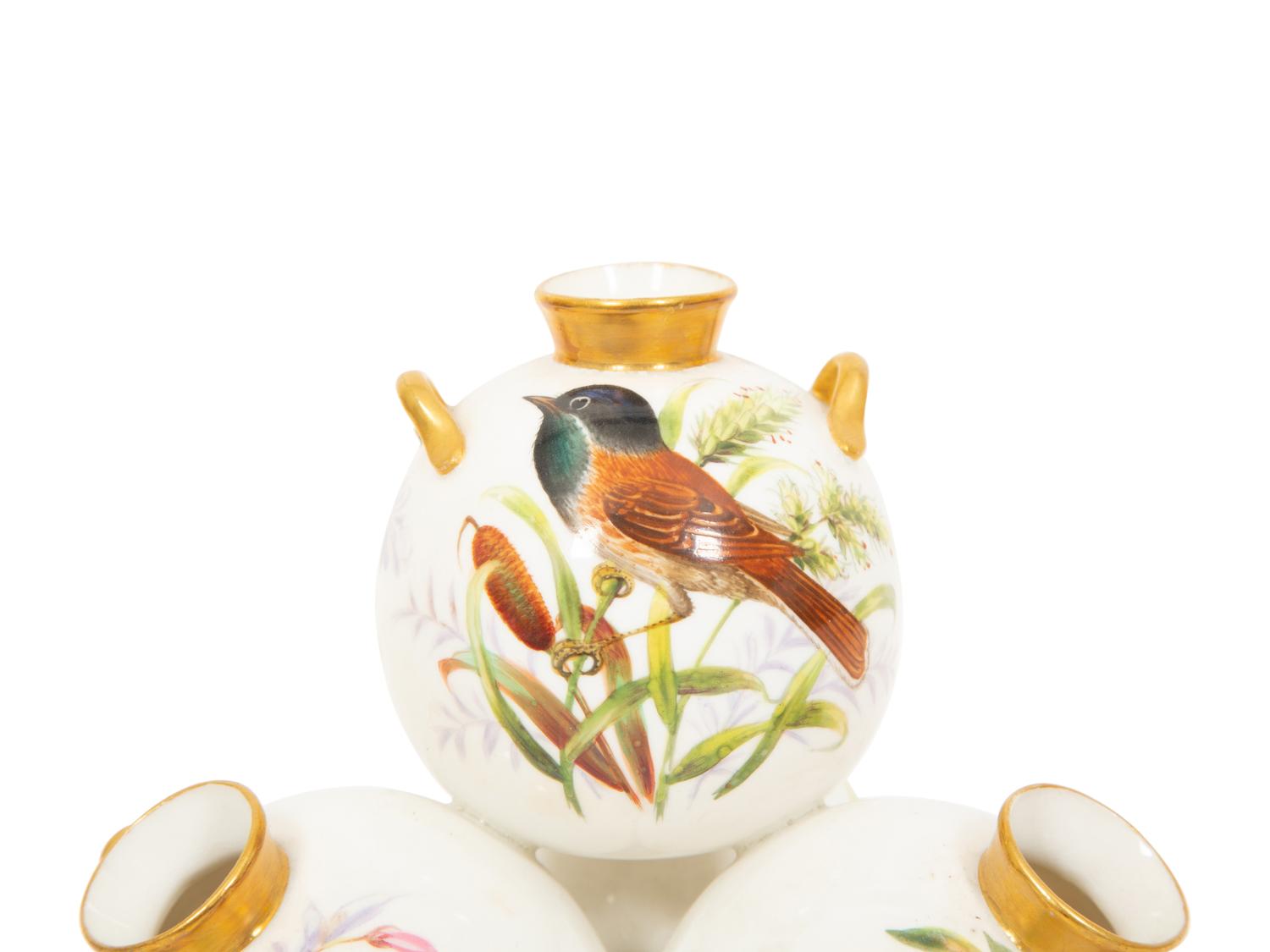 A Royal Worcester Porcelain Multi-stack of Ten Vases with Hand Painted Bird Decoration