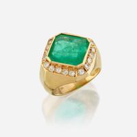 An emerald, diamond, and eighteen karat gold ring
