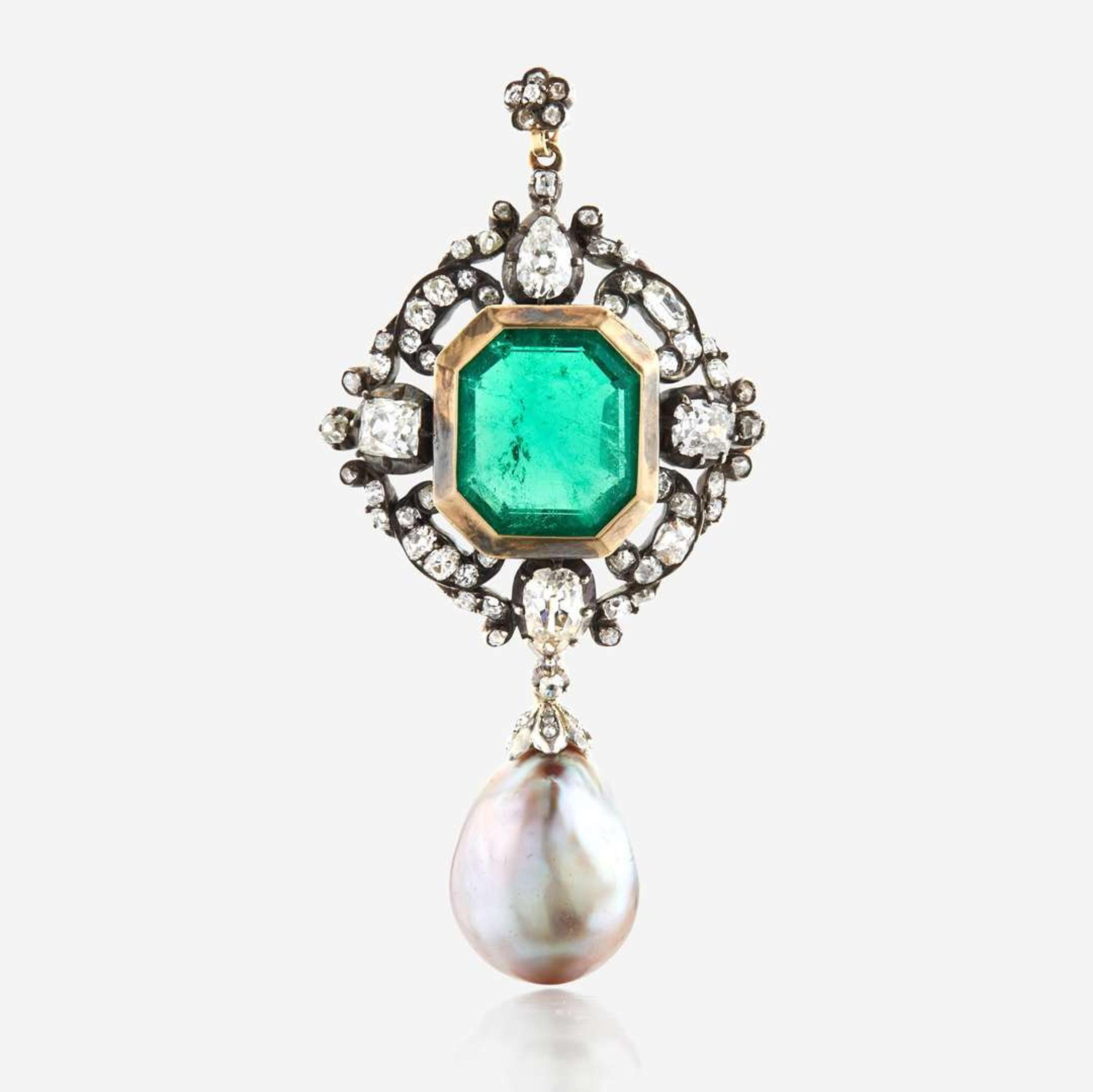 A Victorian emerald, diamond, pearl, and silver topped gold pendant/brooch
