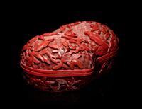 A Chinese Cinnabar Lacquer Double-Peach Form Box and Cover
