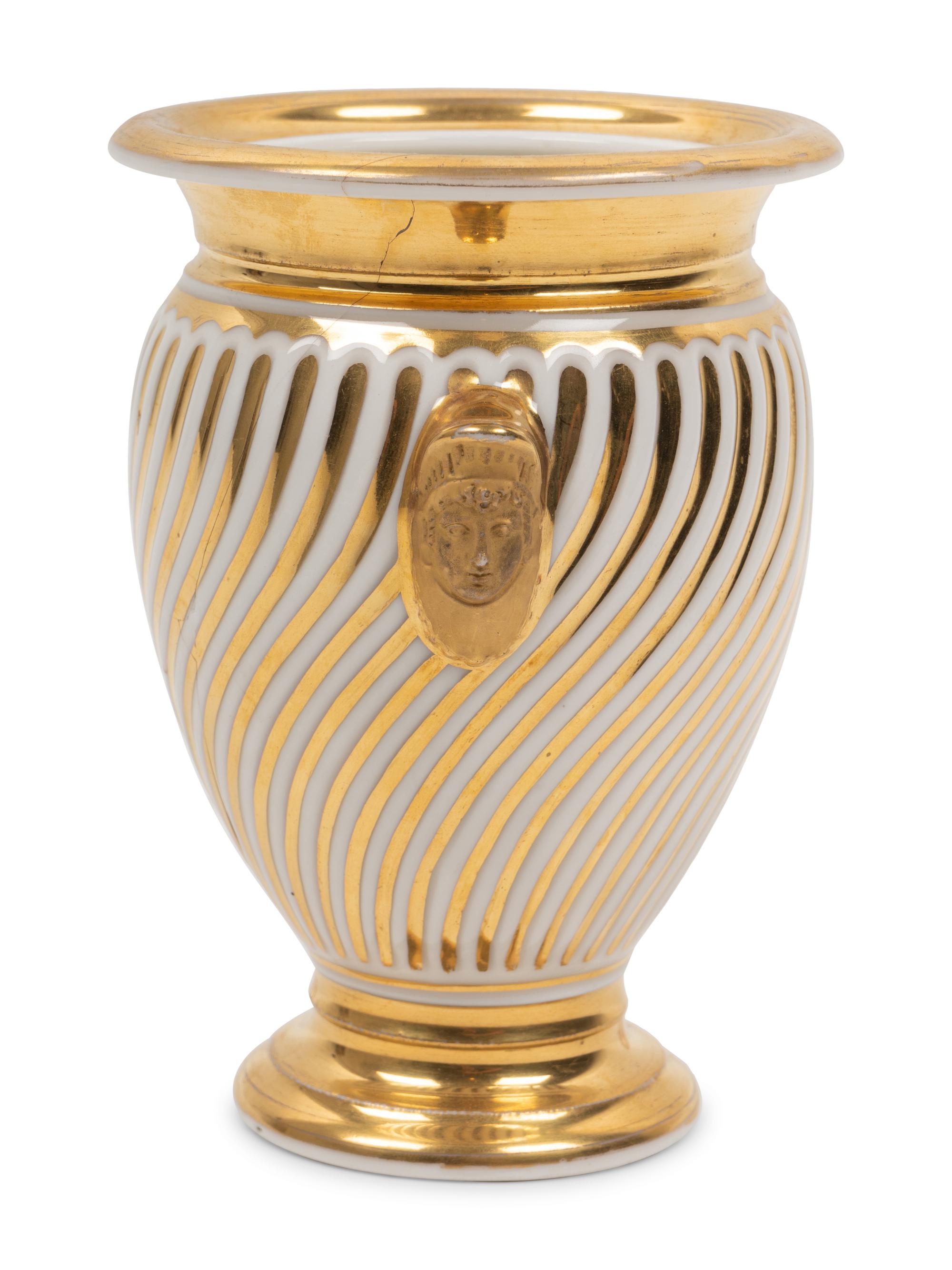 A Continental Parcel Gilt Porcelain Spiral Molded Vase
