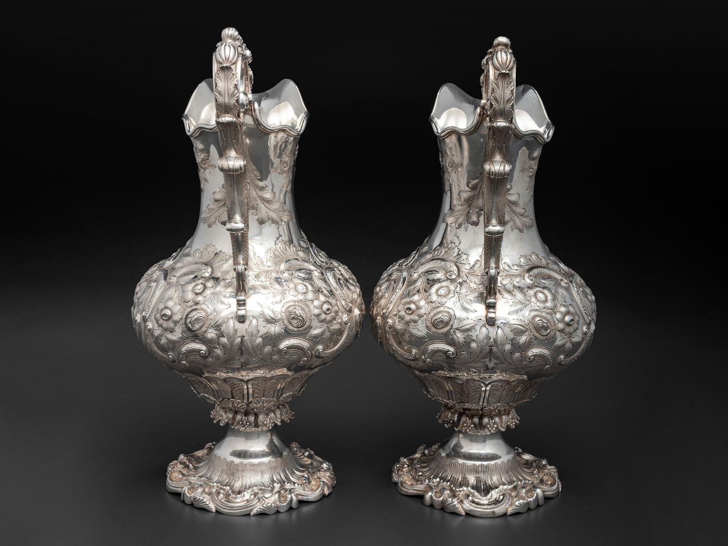 A Pair of American Repousse Silver Presentation Pitchers