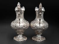 A Pair of American Repousse Silver Presentation Pitchers