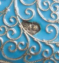 A Russian Enameled Silver Box, Moscow, late 19th century, the case with a light blue enameled ground and filigree scrolls throughout.