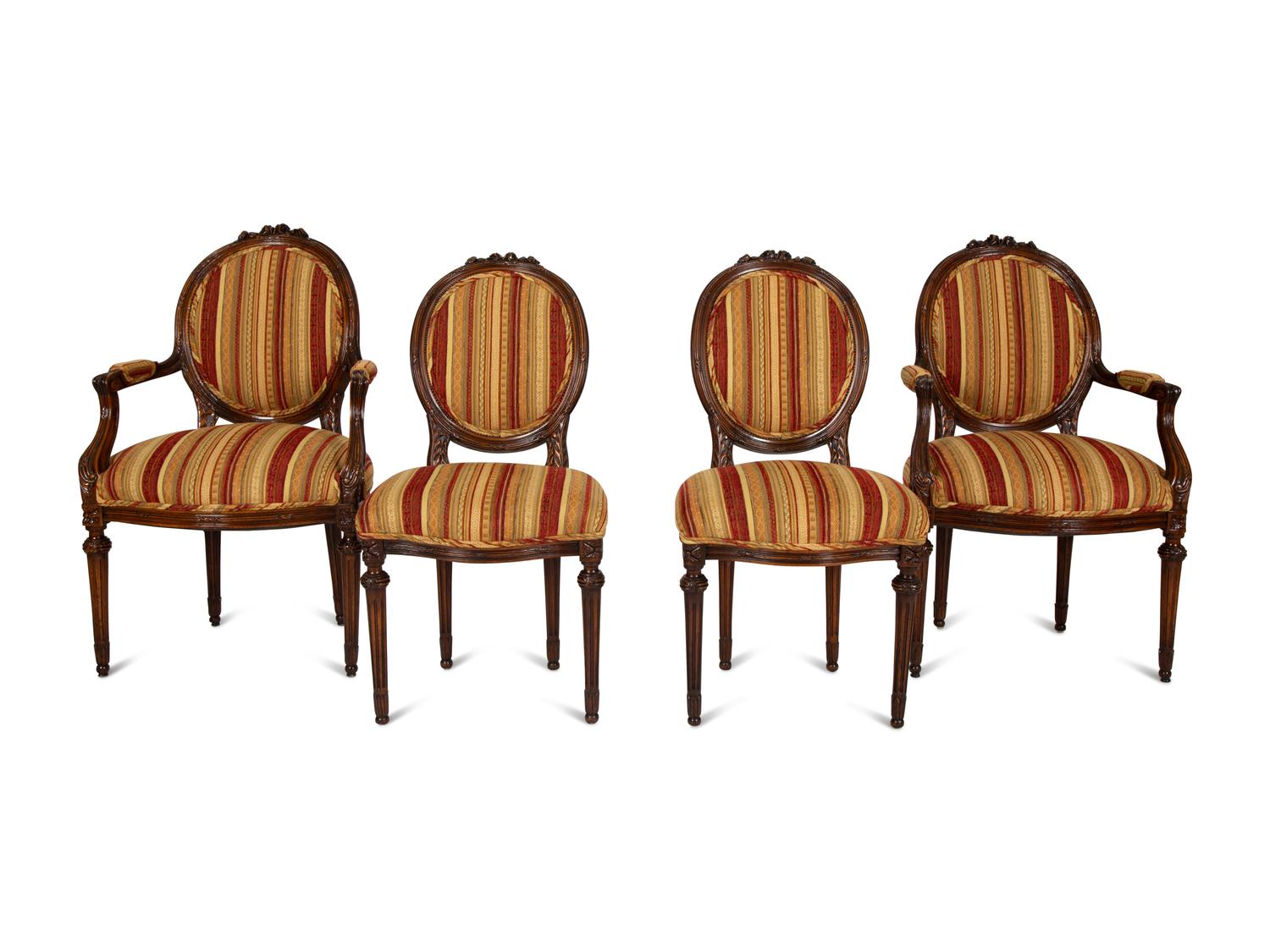 Four Louis XVI Style Carved Walnut Chairs