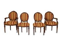 Four Louis XVI Style Carved Walnut Chairs