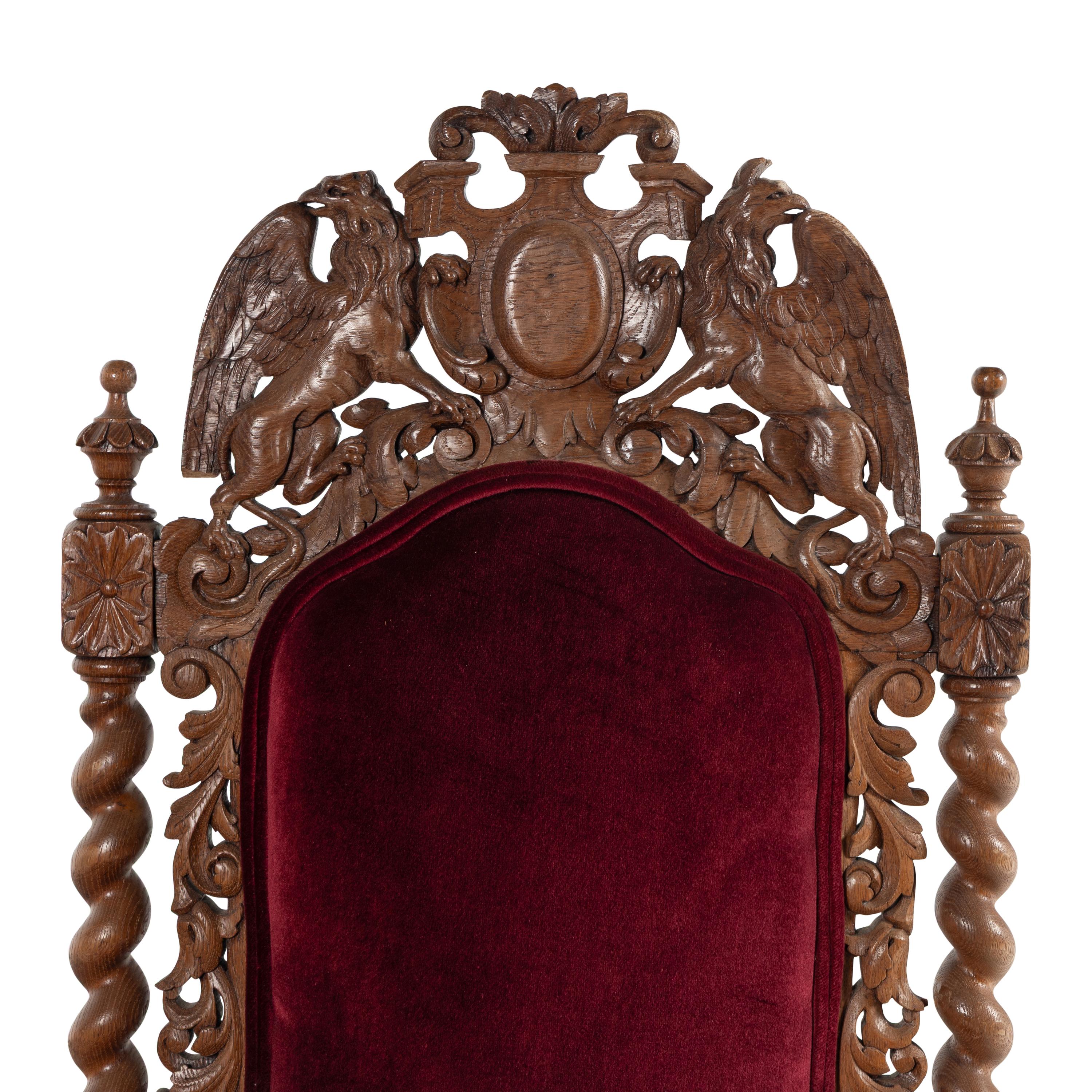 A Set of Twelve Charles II Style Carved Oak Dining Chairs