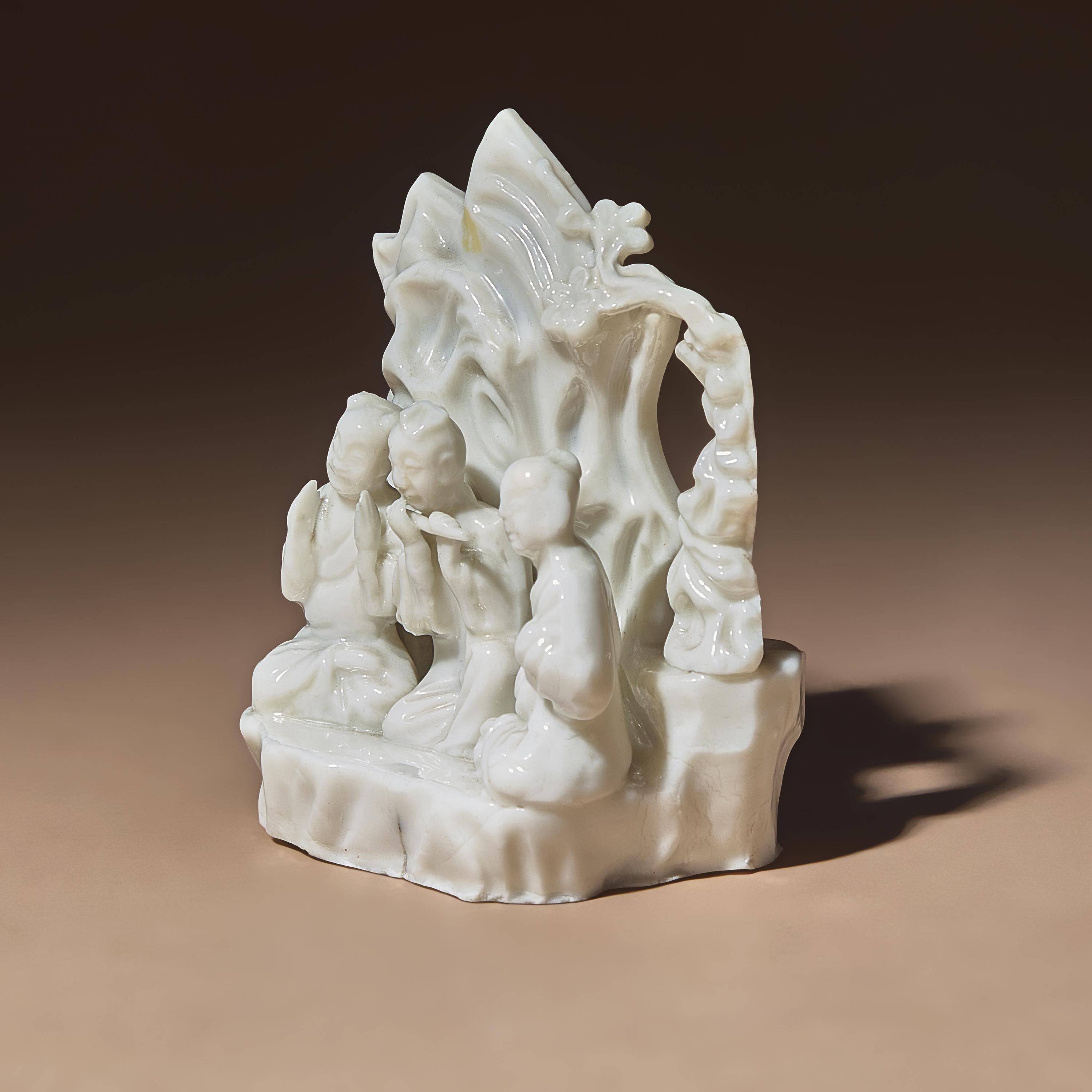 A Chinese Blanc-de-Chine Porcelain Figural Group of Three Musicians, 18th Century — 清中期 德化白瓷塑吹奏圖山子