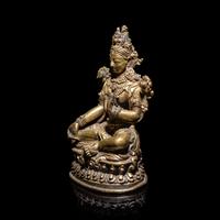 A Tibetan Gilt Bronze Seated Figure of White Tara, 15th/16th Century 十五/十六世紀 西藏銅鎏金白度母像