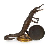 A Taxidermy Cayman Crocodile with Gong — 20TH CENTURY