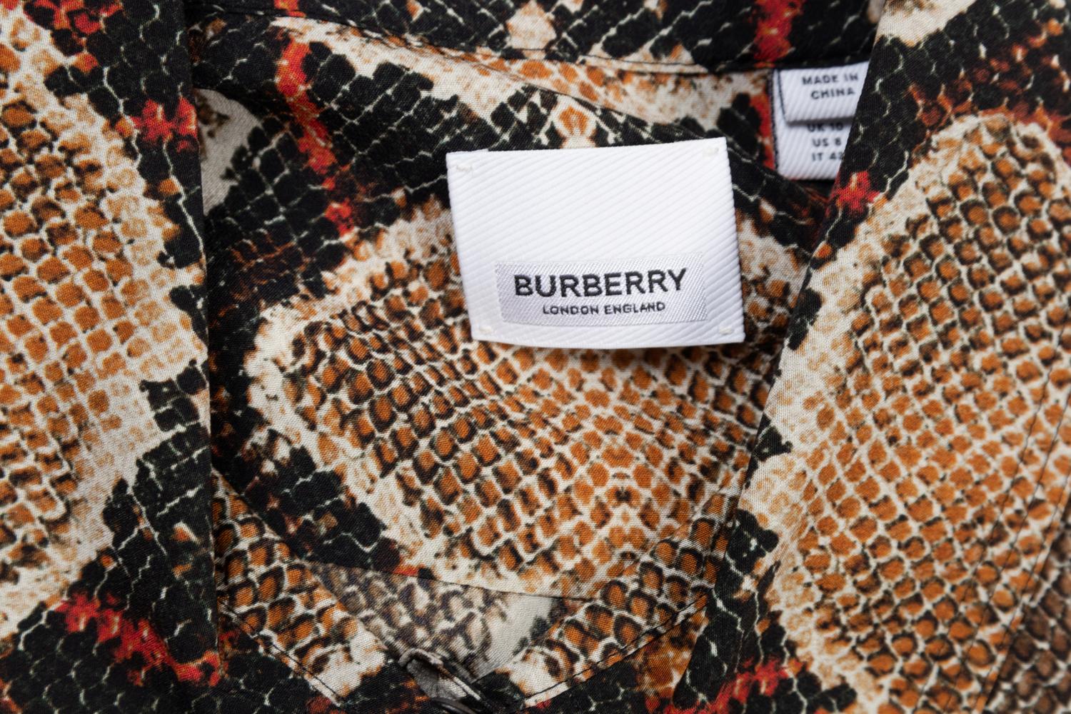 Five Designer Tops: One Carolina Herrera, One Loro Piana, One Dolce and Gabbana, One Burberry, and One The Row