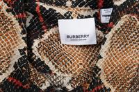 Five Designer Tops: One Carolina Herrera, One Loro Piana, One Dolce and Gabbana, One Burberry, and One The Row