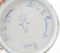A Sevres Jeweled Porcelain Cup Height of cup 2 7/8 inches, diameter of saucer 5 1/8 inches.