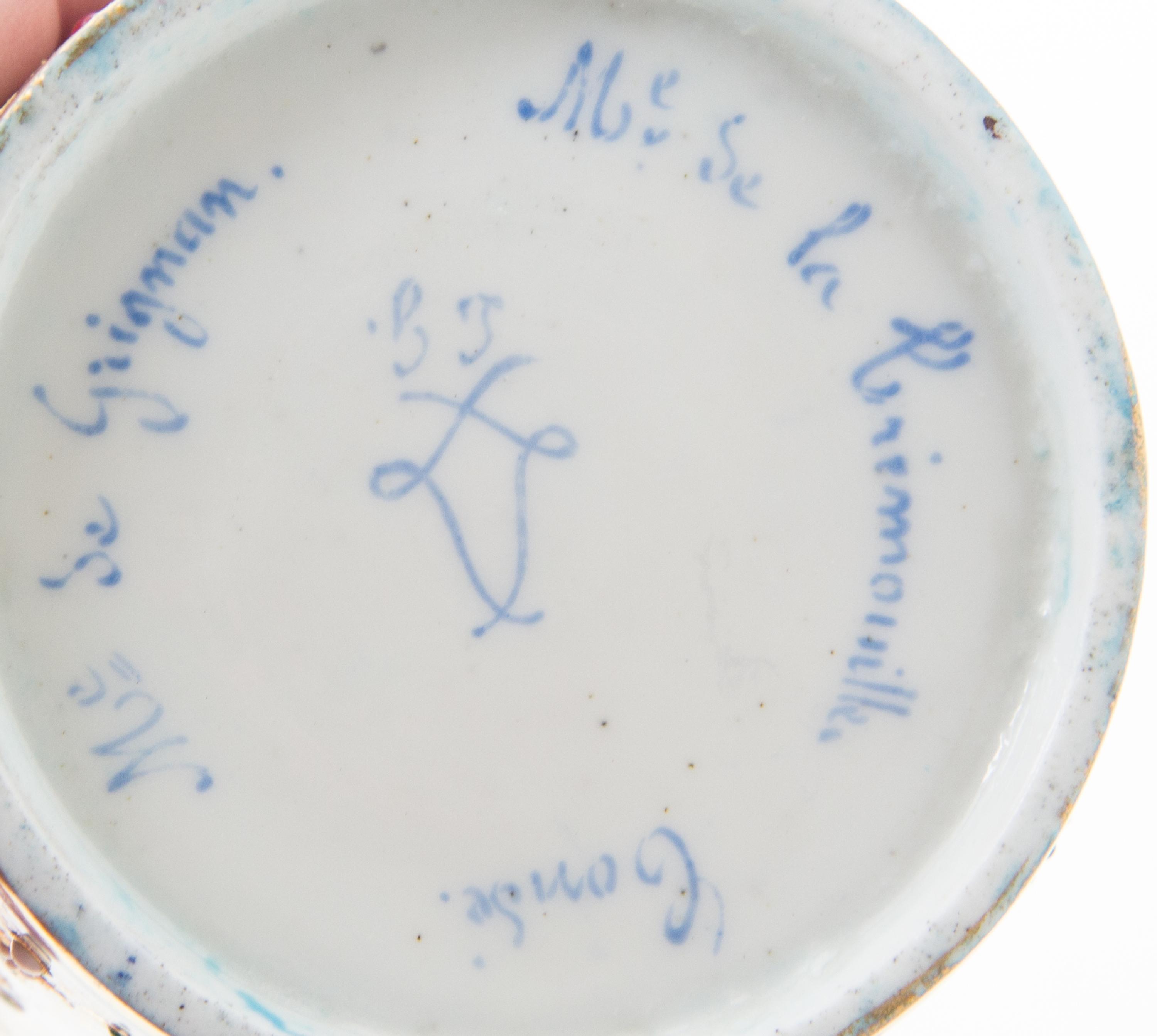 A Sevres Jeweled Porcelain Cup Height of cup 2 7/8 inches, diameter of saucer 5 1/8 inches.