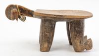 A Group of Five Wood Stools and Neck Rests Height of tallest 10 1/4 inches.