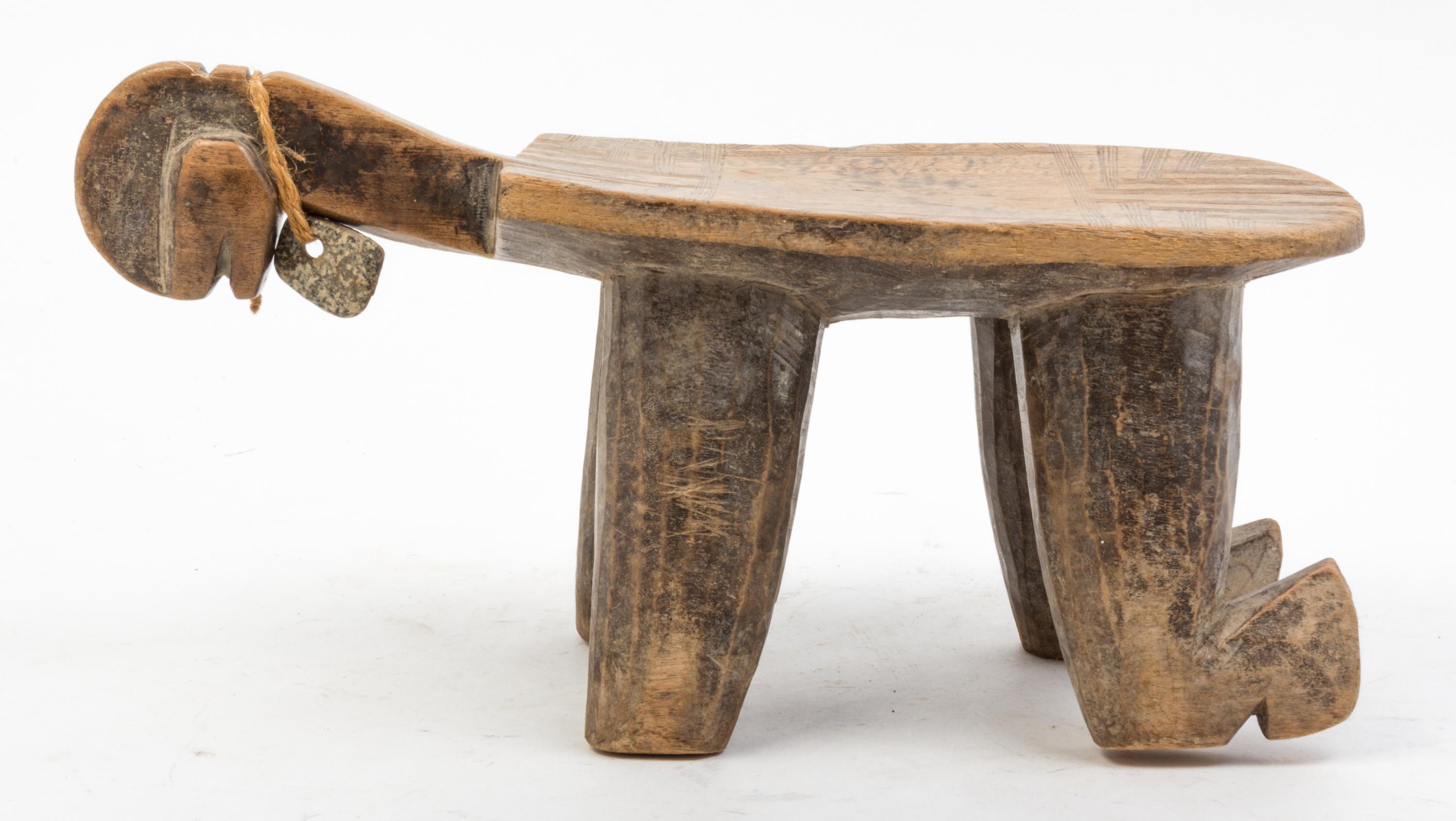A Group of Five Wood Stools and Neck Rests Height of tallest 10 1/4 inches.