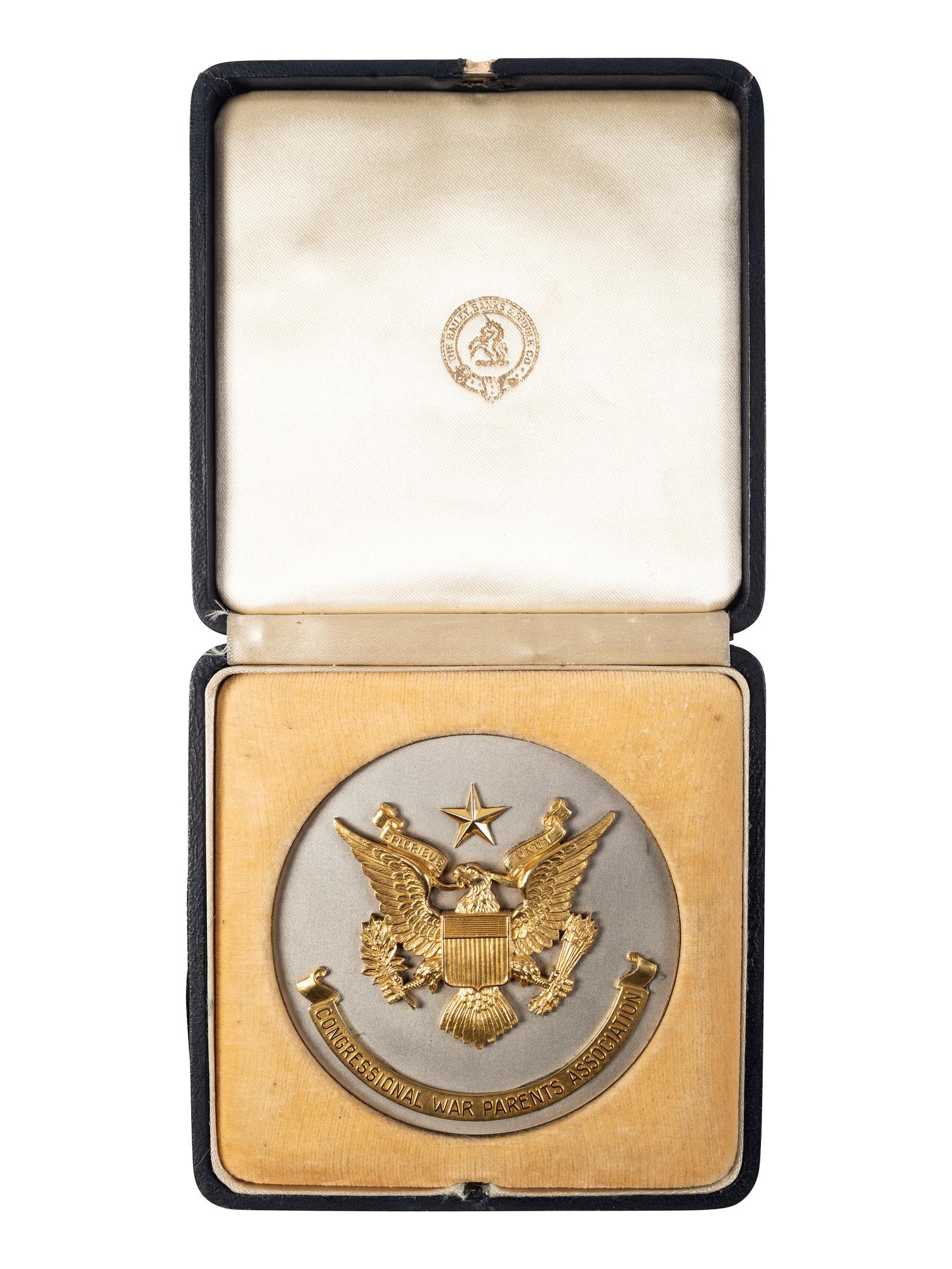 [WORLD WAR II]. A group of 3 items, highlighted by "Congressional War Parents Association" medallion presented to Ellsworth B. Buck for the loss of his son, 1st Lieutenant Orlando J. Buck.